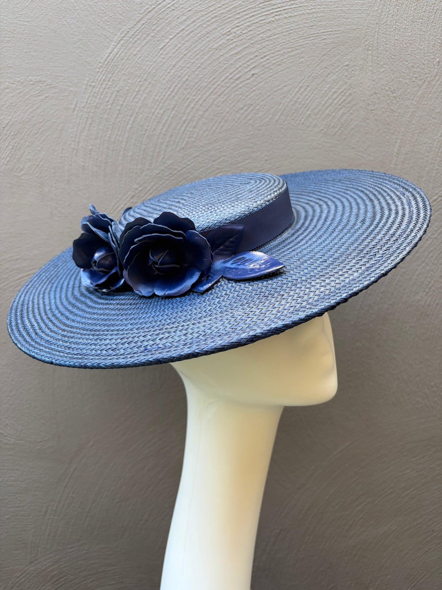 Wide‑brim navy blue straw boater hat with handcrafted leather roses.
