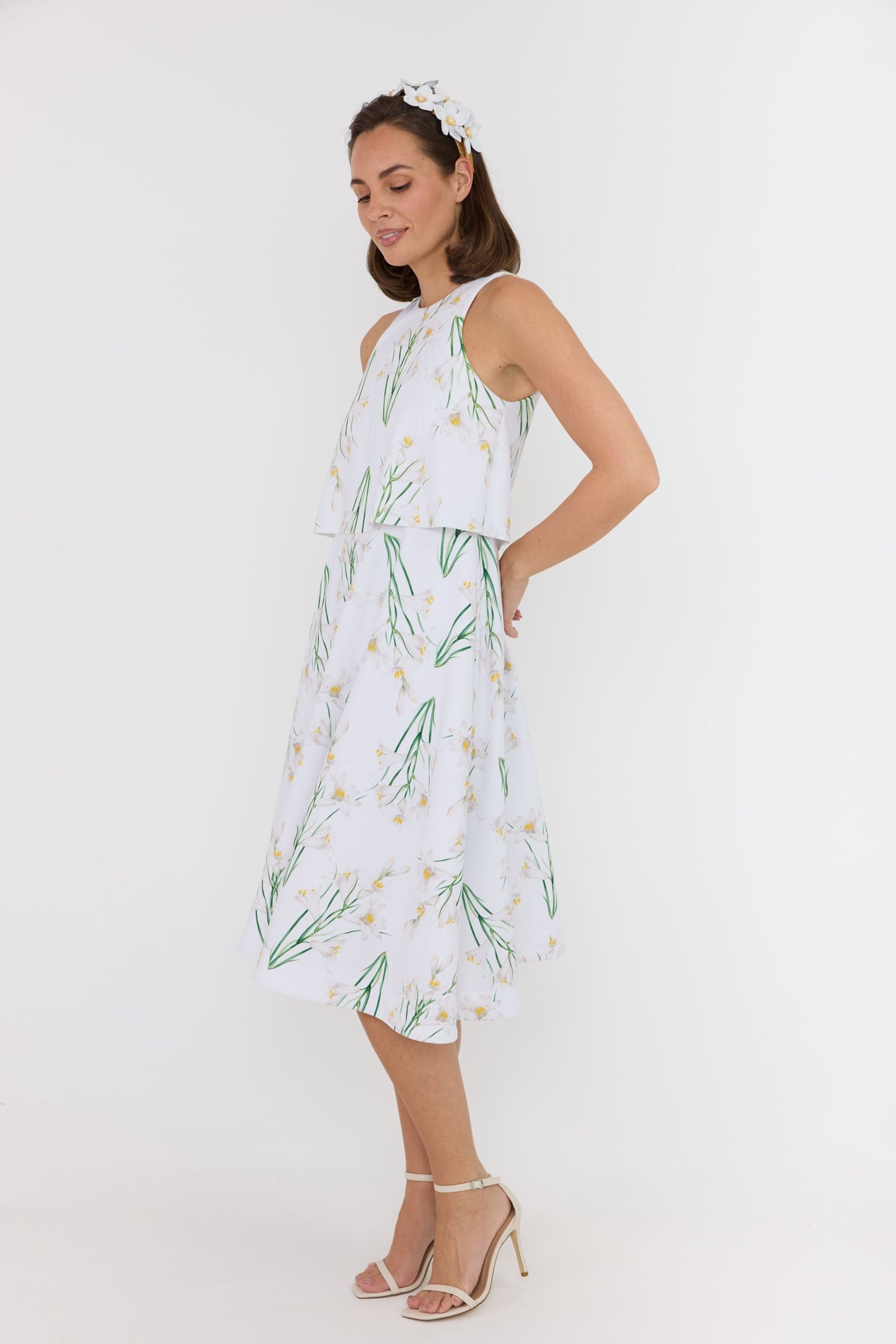 white leather flowers headpiece and white floral dress