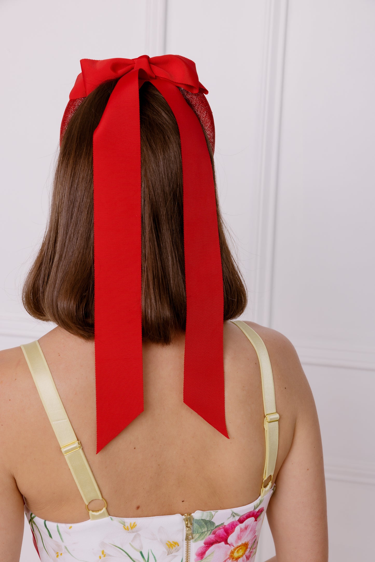 red headband with red ribbon bows