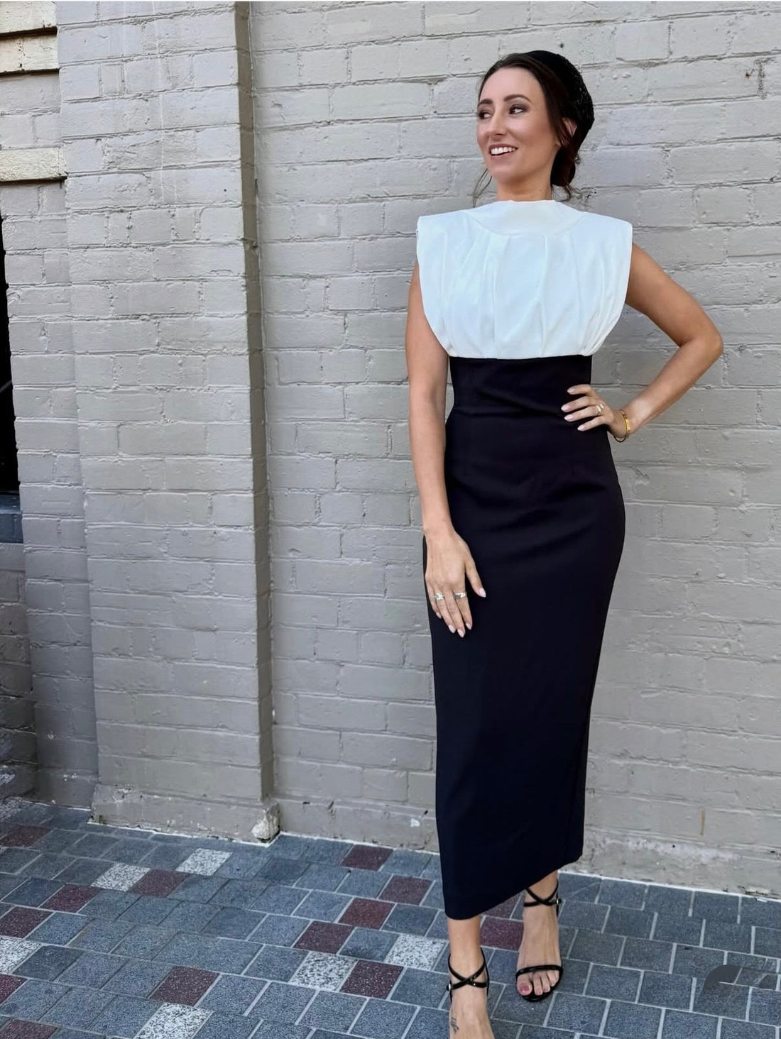 Katelyn McDonald in a black‑and‑white Derby Day ensemble featuring a Marla Carmeta hat with vintage detailing.