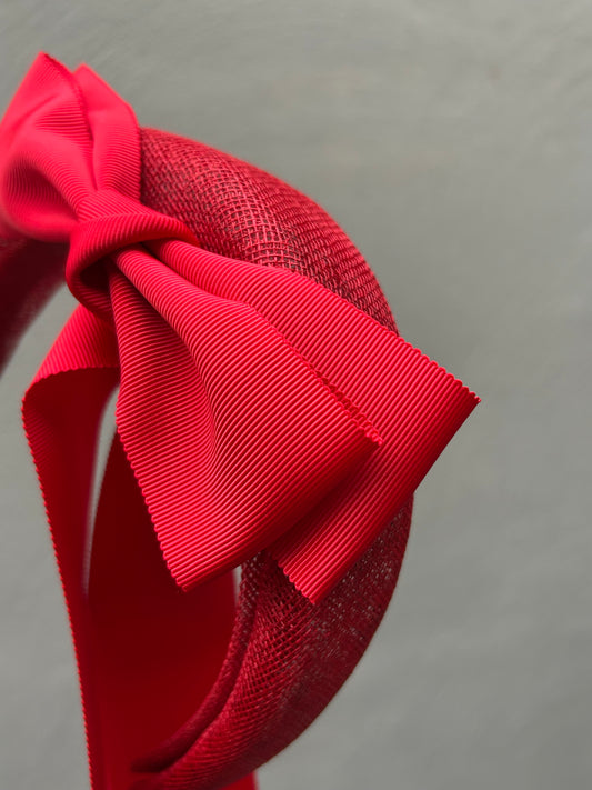 Handcrafted red bow headband for Melbourne Cup race day fashion.