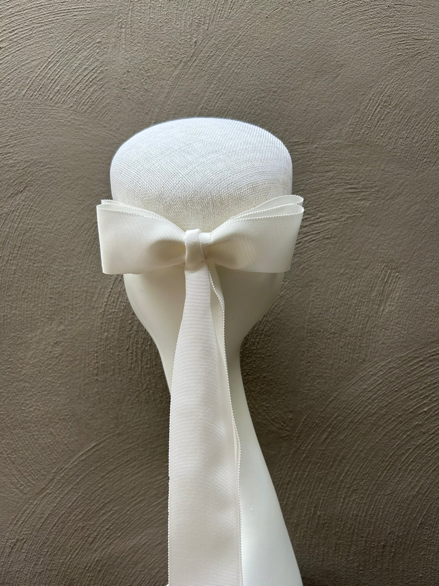 White hat with double bow
