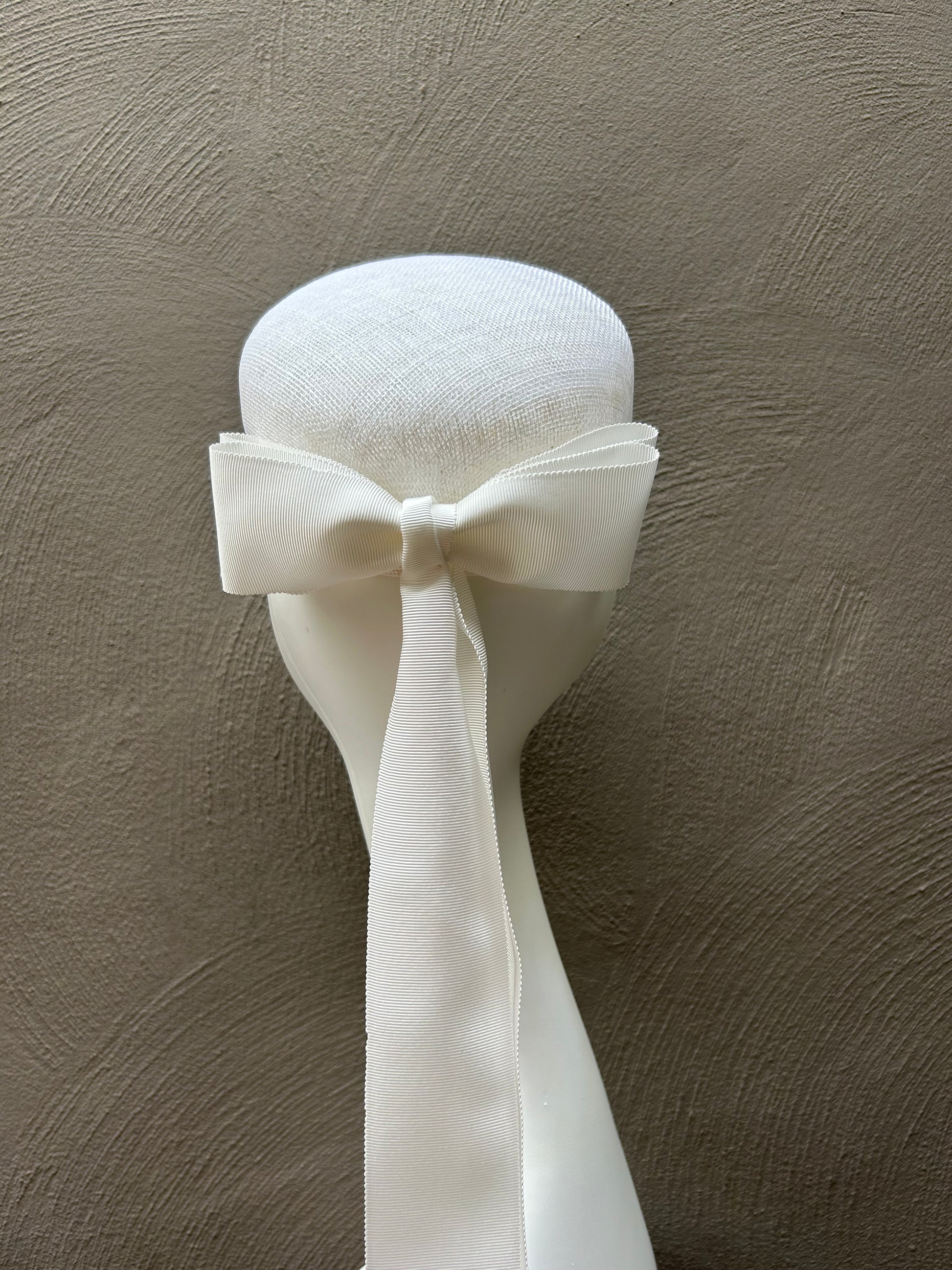 White hat with double bow