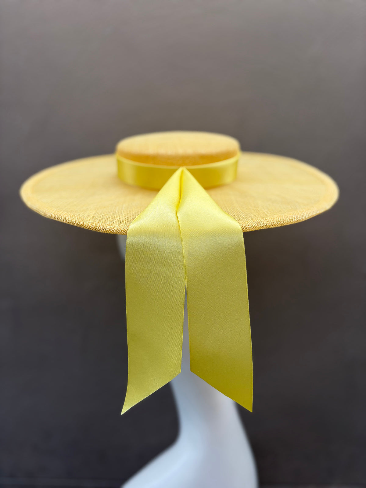 Elegant two-tone lemon ribbon boater for race day and special occasions